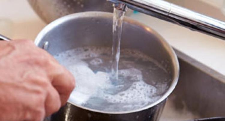 hand washing a small pot 